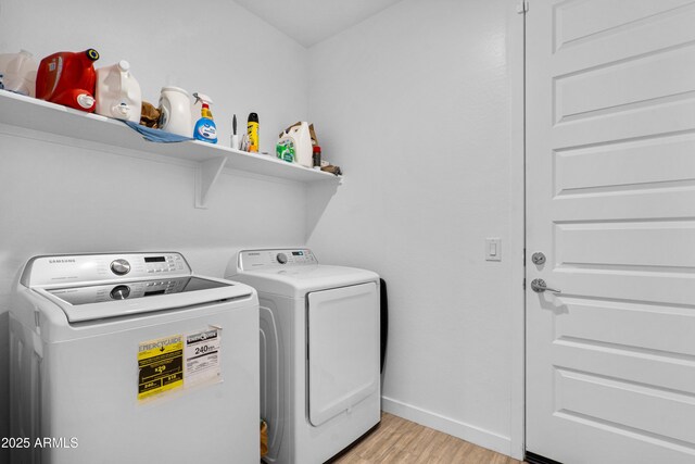 1541 W Carmen St, Phoenix, AZ 85041 - washroom with washing machine and clothes dryer, light wood finished floors, and baseboards