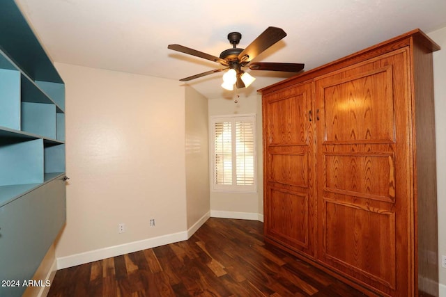 unfurnished bedroom featuring ceiling fan, lofted ceiling, and dark wood-type flooring