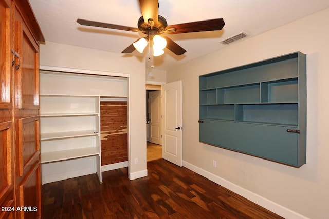 unfurnished bedroom featuring dark hardwood / wood-style flooring, a closet, and ceiling fan