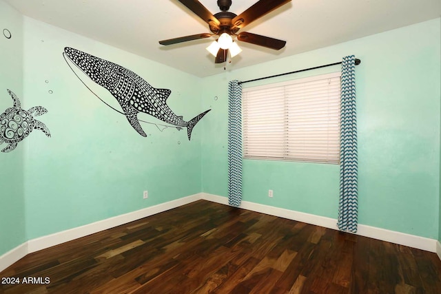 spare room featuring hardwood / wood-style floors and ceiling fan