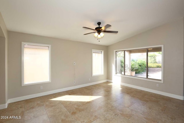 spare room with ceiling fan and lofted ceiling