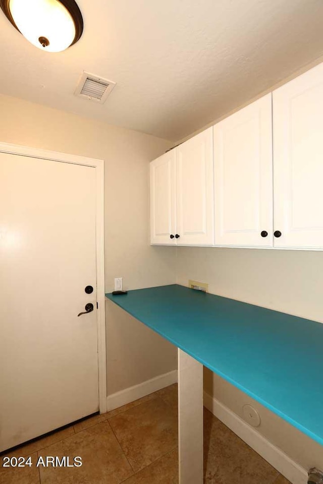 washroom featuring tile patterned flooring