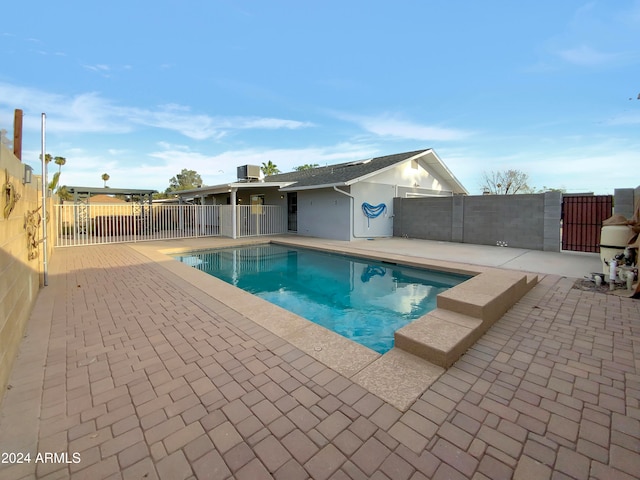 view of swimming pool with a patio area