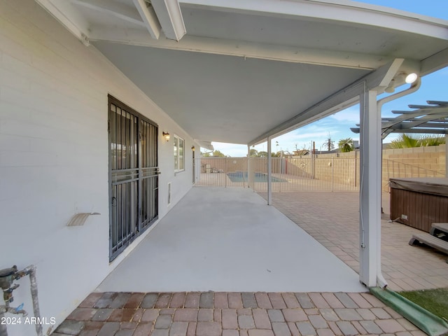 view of patio featuring a hot tub