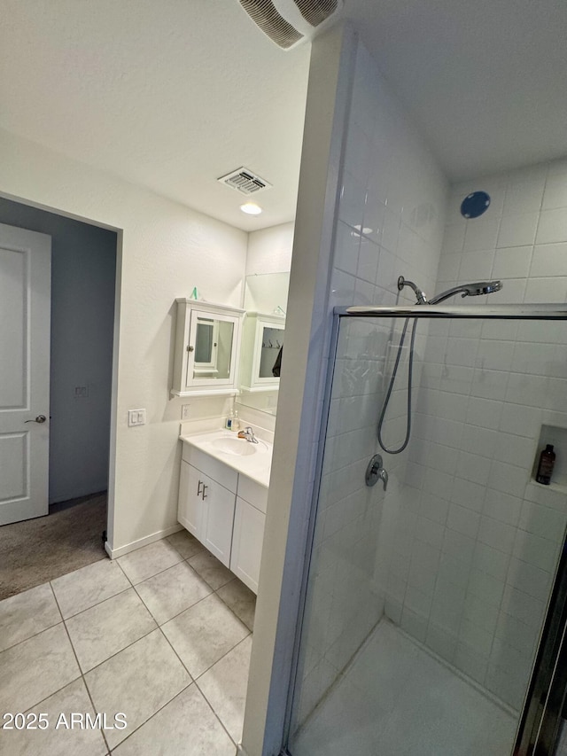 bathroom with tile patterned flooring, a shower stall, and visible vents