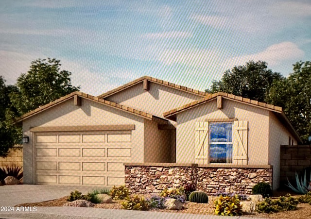 view of front of property with a garage, stone siding, driveway, and a tiled roof