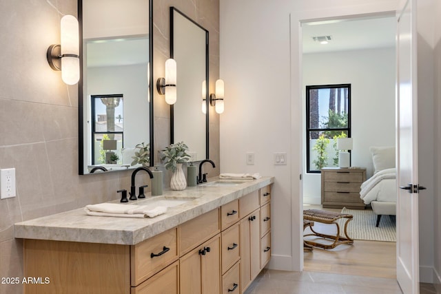 4301 E Sells Dr, Phoenix, AZ 85018 - full bathroom featuring double vanity