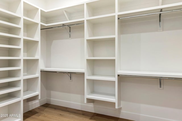 4301 E Sells Dr, Phoenix, AZ 85018 - walk in closet with wood finished floors