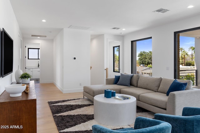 4301 E Sells Dr, Phoenix, AZ 85018 - living area with healthy amount of natural light, light wood-style flooring, recessed lighting, and baseboards