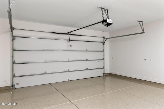 4301 E Sells Dr, Phoenix, AZ 85018 - garage with a garage door opener and baseboards
