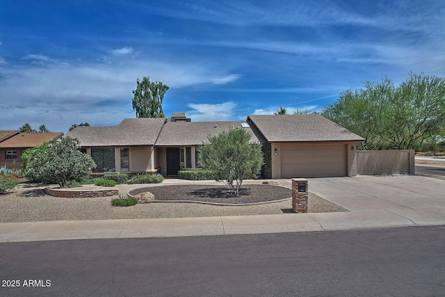 9476 E Laurel Ln, Scottsdale, AZ 85260 - view of front of house featuring concrete driveway and a garage