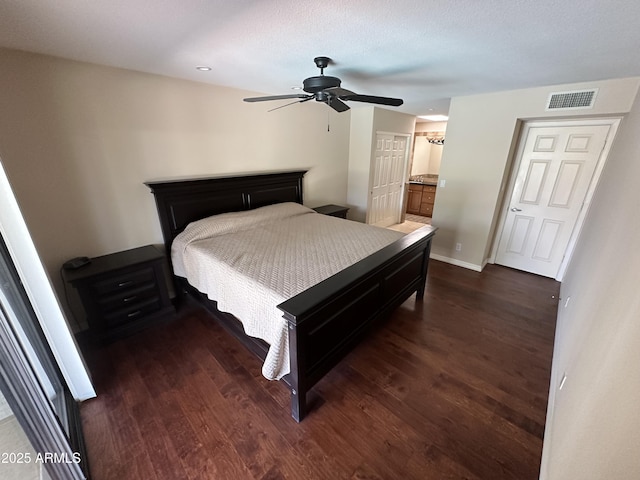 9476 E Laurel Ln, Scottsdale, AZ 85260 - bedroom with dark wood-type flooring, baseboards, a ceiling fan, and recessed lighting