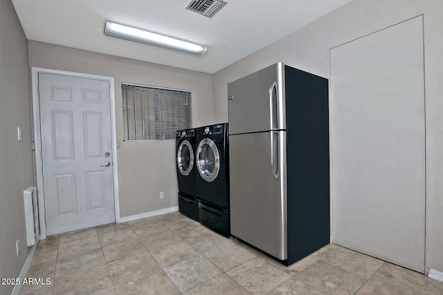 9476 E Laurel Ln, Scottsdale, AZ 85260 - laundry room featuring separate washer and dryer and baseboards