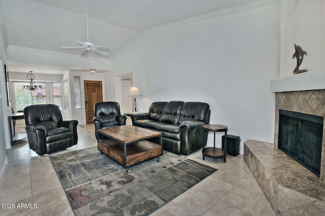 9476 E Laurel Ln, Scottsdale, AZ 85260 - living room with a ceiling fan, tile patterned floors, a fireplace with raised hearth, crown molding, and a chandelier