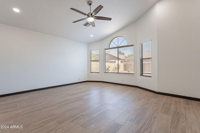 unfurnished room featuring light wood-type flooring, ceiling fan, and lofted ceiling