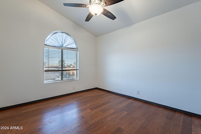 unfurnished room featuring ceiling fan, dark wood-type flooring, and vaulted ceiling