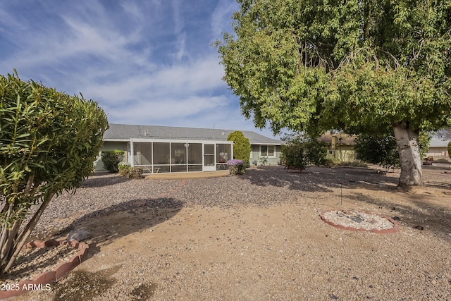 rear view of house with a sunroom