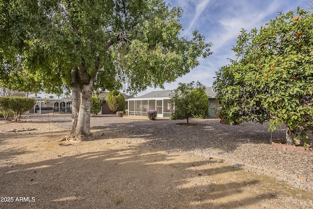 view of yard featuring a sunroom