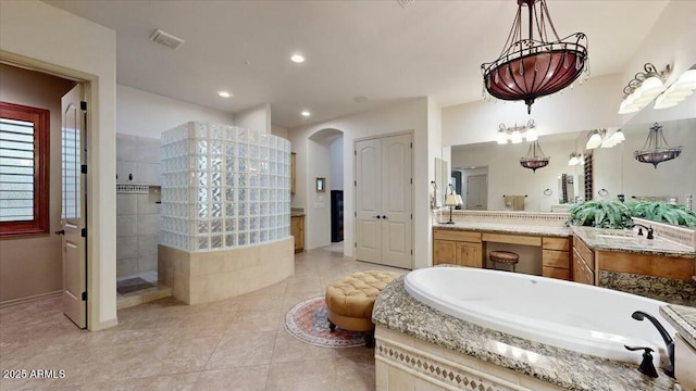 bathroom with vanity, separate shower and tub, and tile patterned flooring