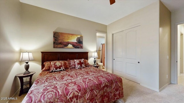 carpeted bedroom featuring a closet and ceiling fan