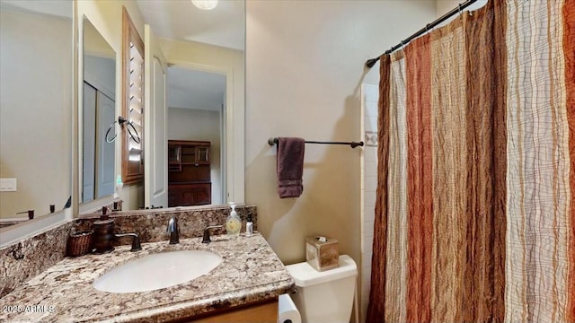 bathroom with vanity and toilet