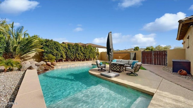 view of swimming pool featuring outdoor lounge area and a patio area