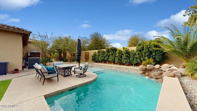 view of pool featuring cooling unit and a patio