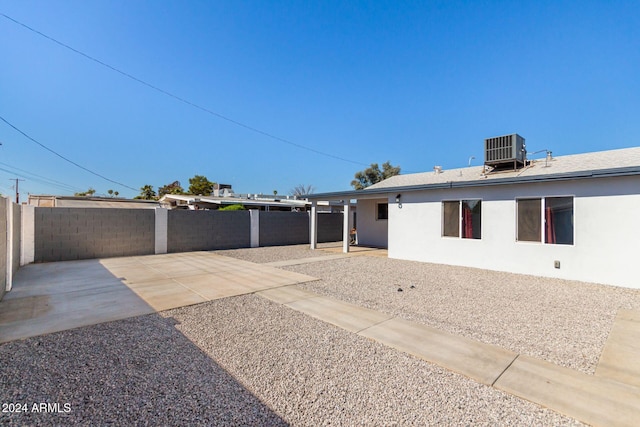 back of property with a patio area and cooling unit