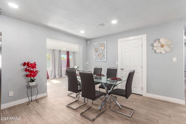 dining area with light hardwood / wood-style flooring