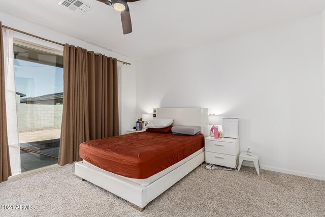 carpeted bedroom with ceiling fan and access to outside