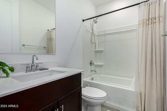 full bathroom featuring vanity, toilet, shower / tub combo, and hardwood / wood-style flooring