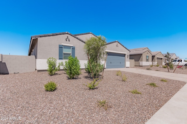 ranch-style house featuring a garage