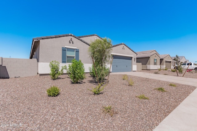 3454 E Jasmine Way, San Tan Valley, AZ 85143 - ranch-style house with fence, stucco siding, concrete driveway, a garage, and a tile roof