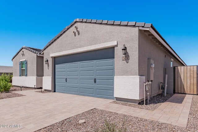 view of side of property featuring a garage