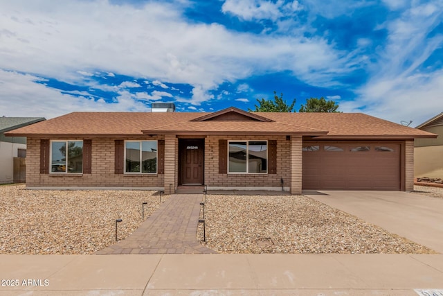 9414 N 50th Dr, Glendale, AZ 85302 - ranch-style home featuring a garage, brick siding, driveway, and a shingled roof