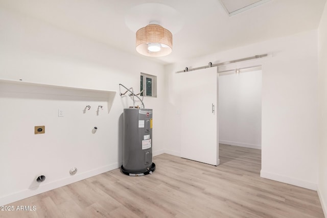9414 N 50th Dr, Glendale, AZ 85302 - washroom featuring hookup for an electric dryer, electric water heater, light wood-type flooring, and a barn door