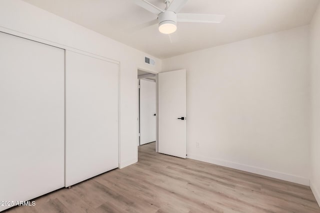 9414 N 50th Dr, Glendale, AZ 85302 - unfurnished bedroom with light wood-style flooring, a closet, baseboards, and ceiling fan