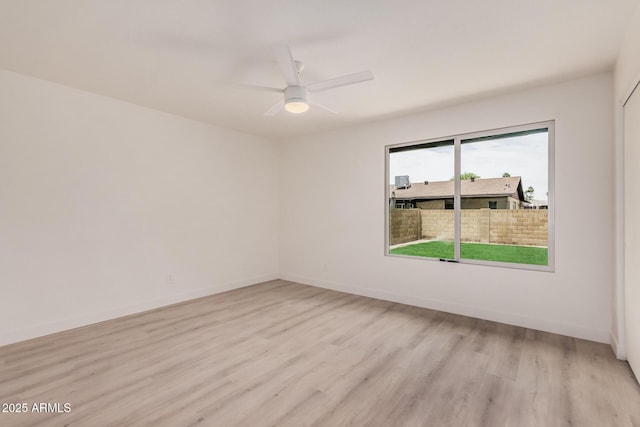 9414 N 50th Dr, Glendale, AZ 85302 - empty room featuring light wood-style floors, ceiling fan, and baseboards