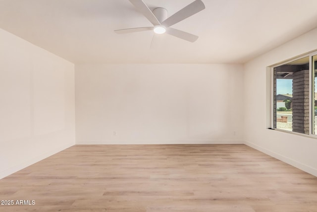 9414 N 50th Dr, Glendale, AZ 85302 - unfurnished room featuring light wood-style floors, a ceiling fan, and baseboards