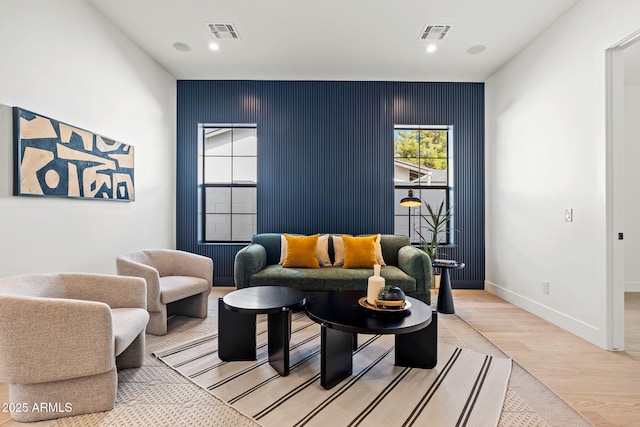 sitting room featuring recessed lighting, baseboards, visible vents, and light wood-style flooring