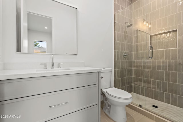 full bathroom with vanity, toilet, and a shower stall