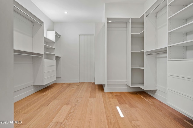 walk in closet featuring light wood-style flooring