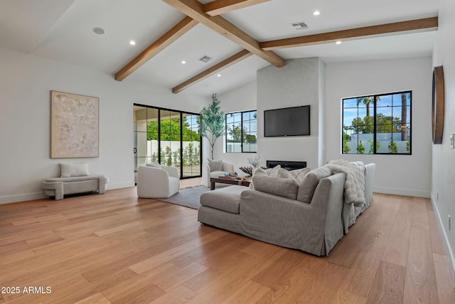 living room with visible vents, recessed lighting, light wood-style floors, and vaulted ceiling with beams