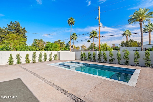 view of swimming pool featuring a fenced backyard, a patio, and a pool with connected hot tub