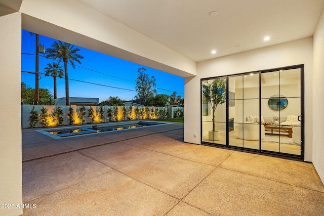 view of patio featuring fence