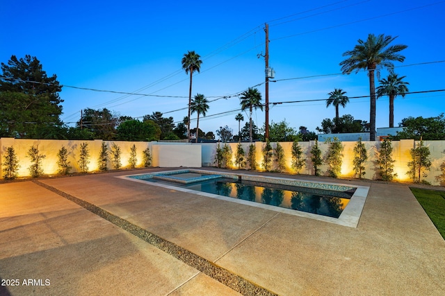 view of swimming pool with a fenced backyard, a fenced in pool, a patio, and an in ground hot tub