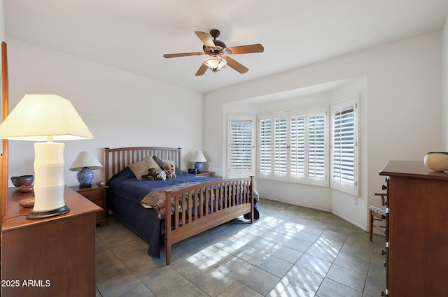 tiled bedroom with ceiling fan