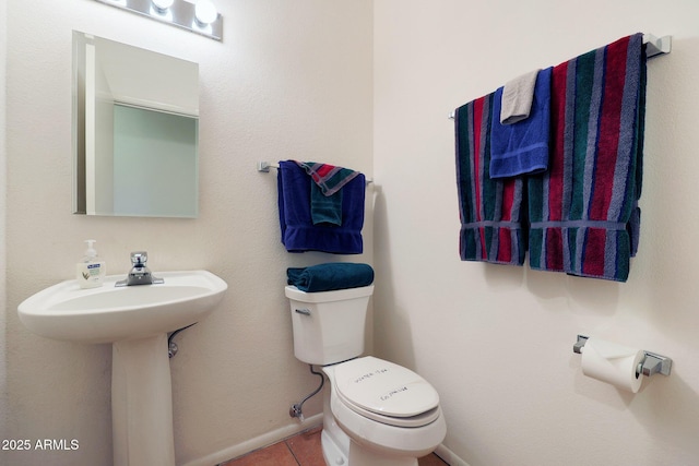 bathroom featuring tile patterned floors and toilet