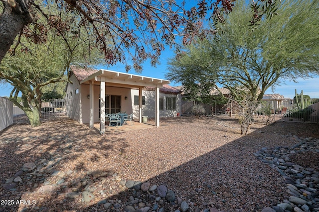 back of house with a patio area