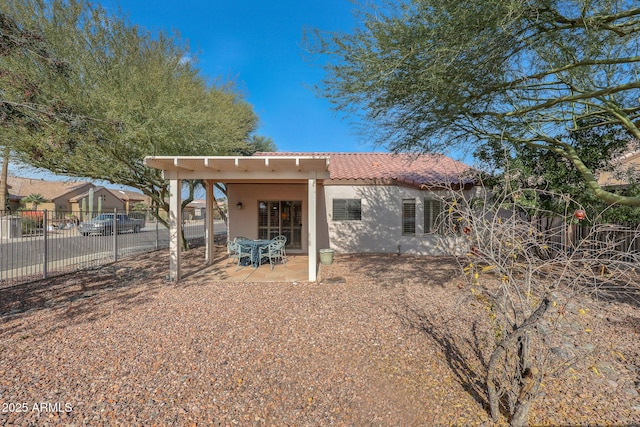 rear view of house featuring a patio